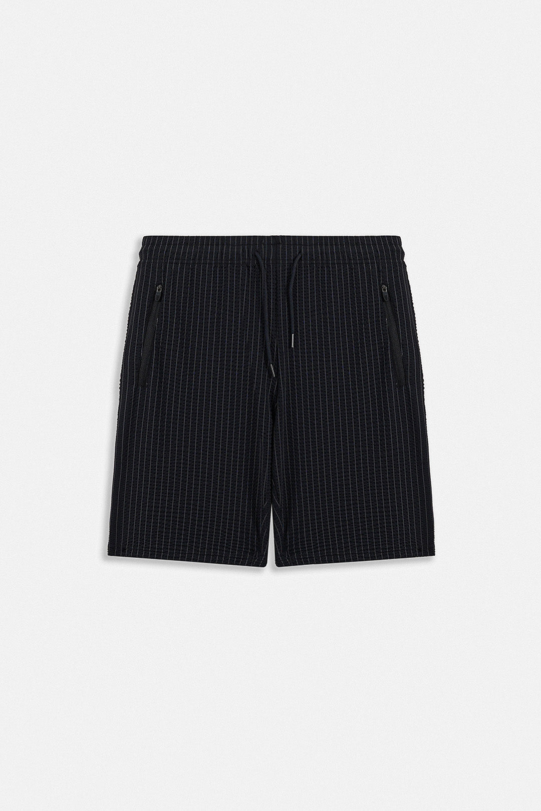 Image of Black pinstriped shorts with a drawstring waist and zippered side pockets, shown flat on a light gray background.