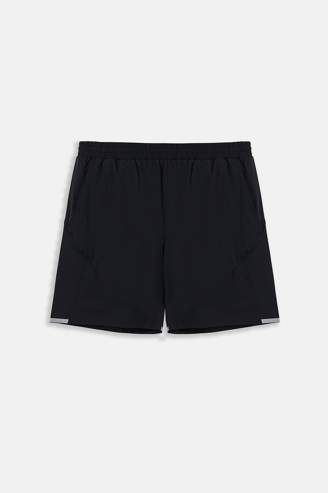 Image of Black athletic shorts with a wide elastic waistband and subtle reflective trim at the hem, shown flat against a light gray background.