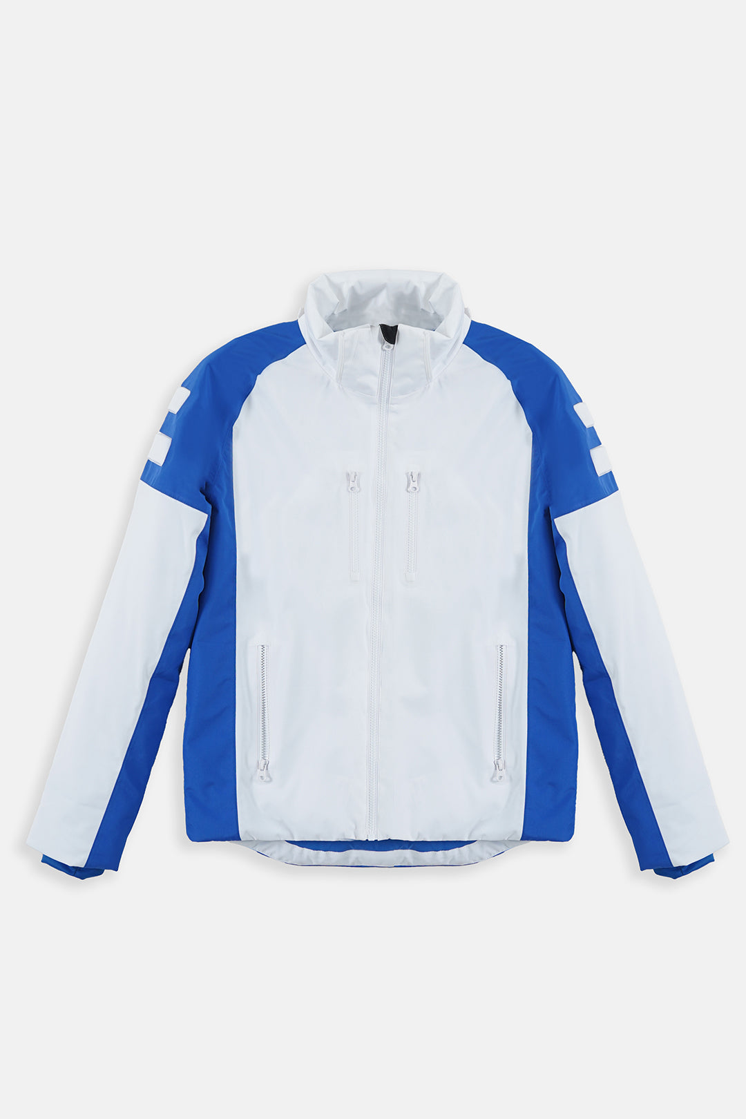 Image of A white and blue color-blocked athletic jacket with a full front zipper, zippered hand pockets, and white logo stripes on the upper sleeves, displayed flat against a light gray background.