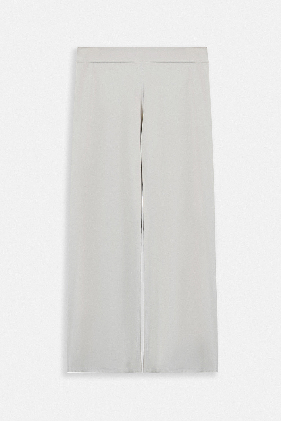 Image of A pair of light gray wide-leg cropped pants with a front slit, shown flat against a light gray background.