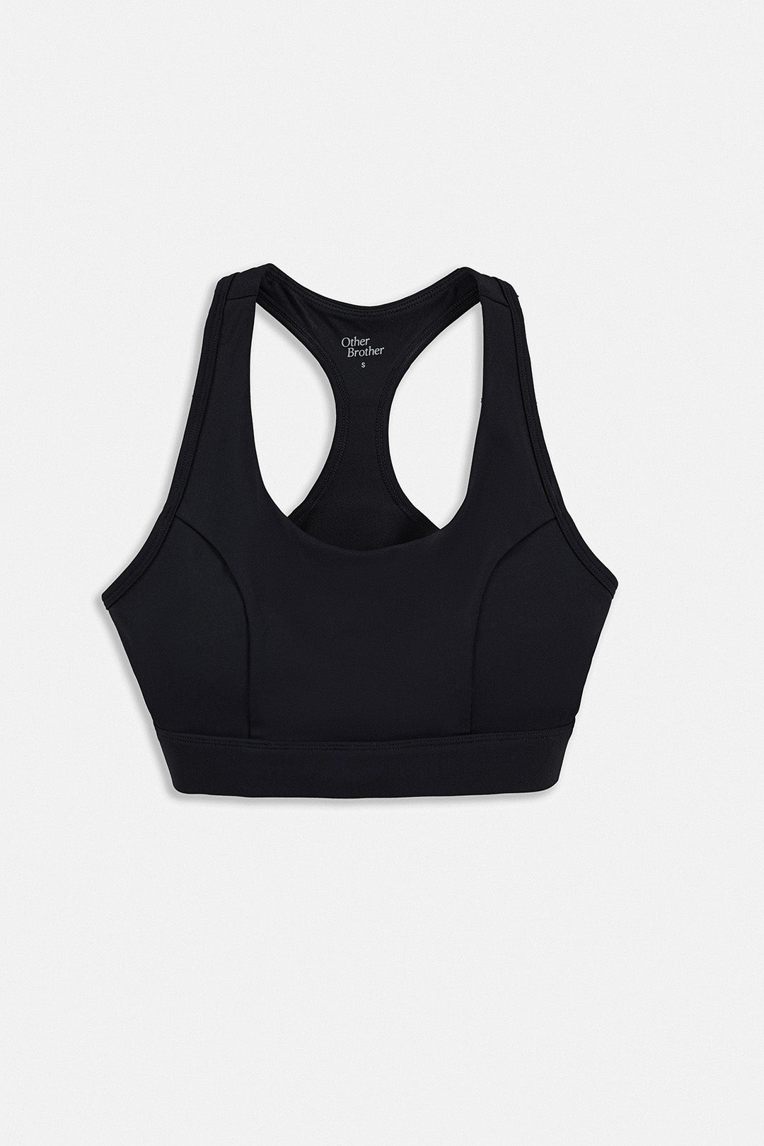 Image of A black racerback sports bra shown from the back on a light gray background.