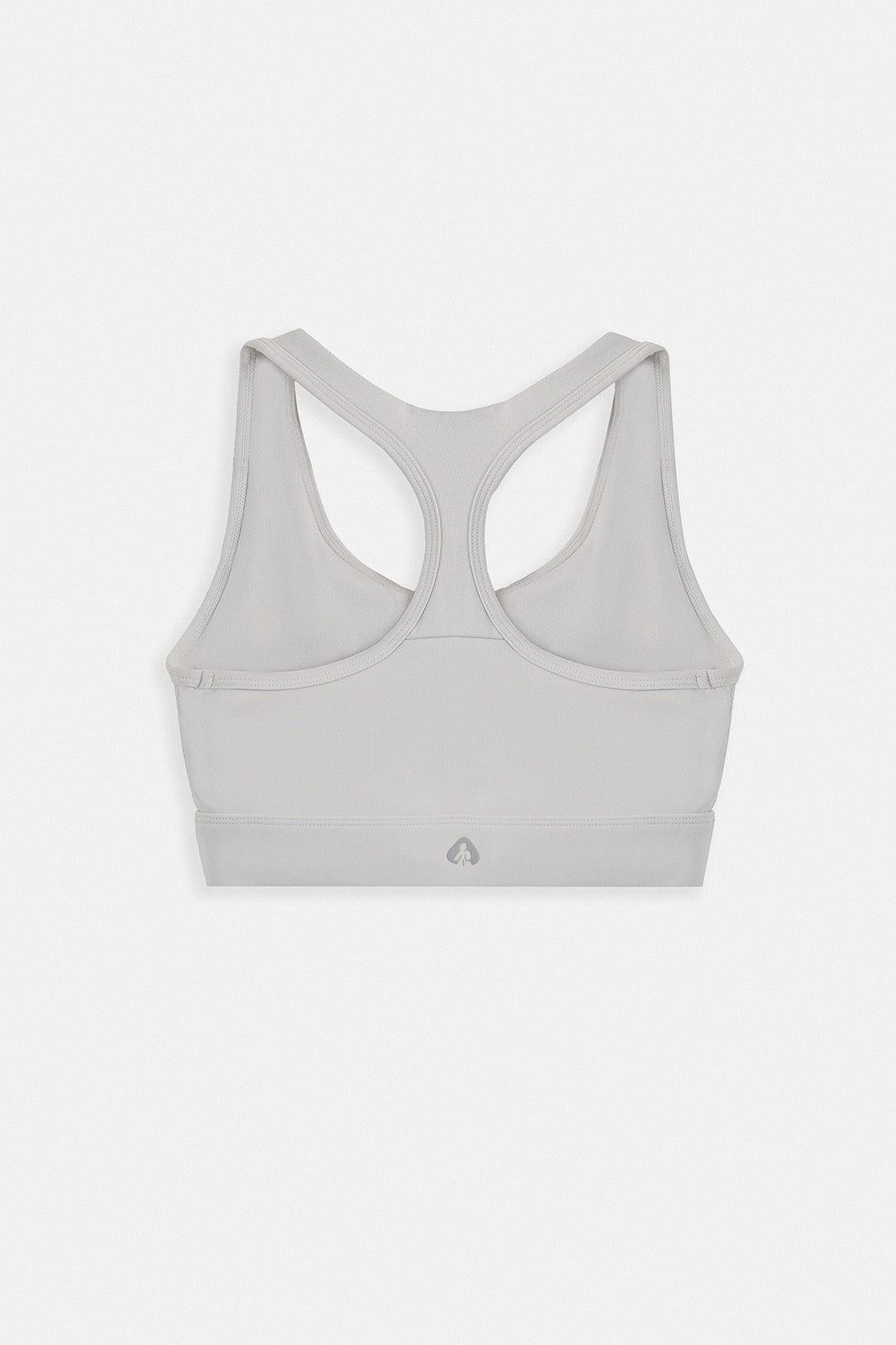 A light gray sports bra with a racerback design, shown from the back on a clean, light gray background.