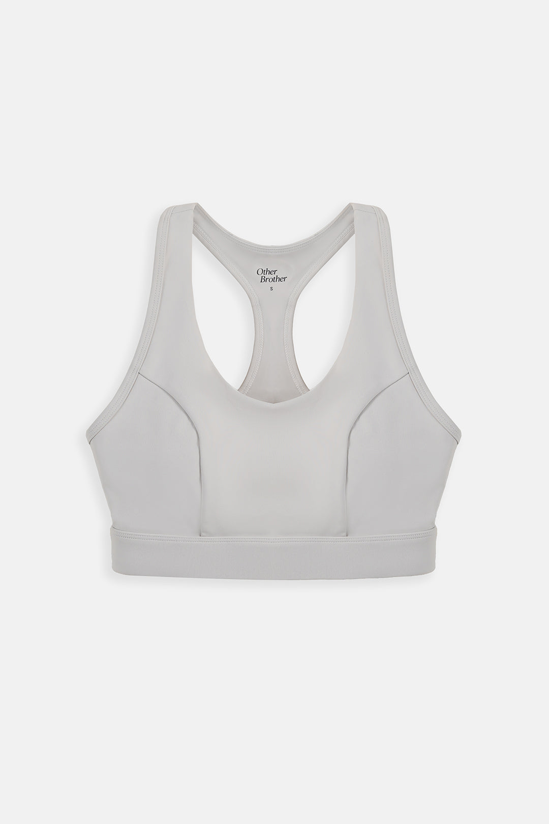 A light gray sports bra with a racerback design, shown from the back on a clean, light gray background. The brand name 'Ultra Broker' is printed inside the neck area.