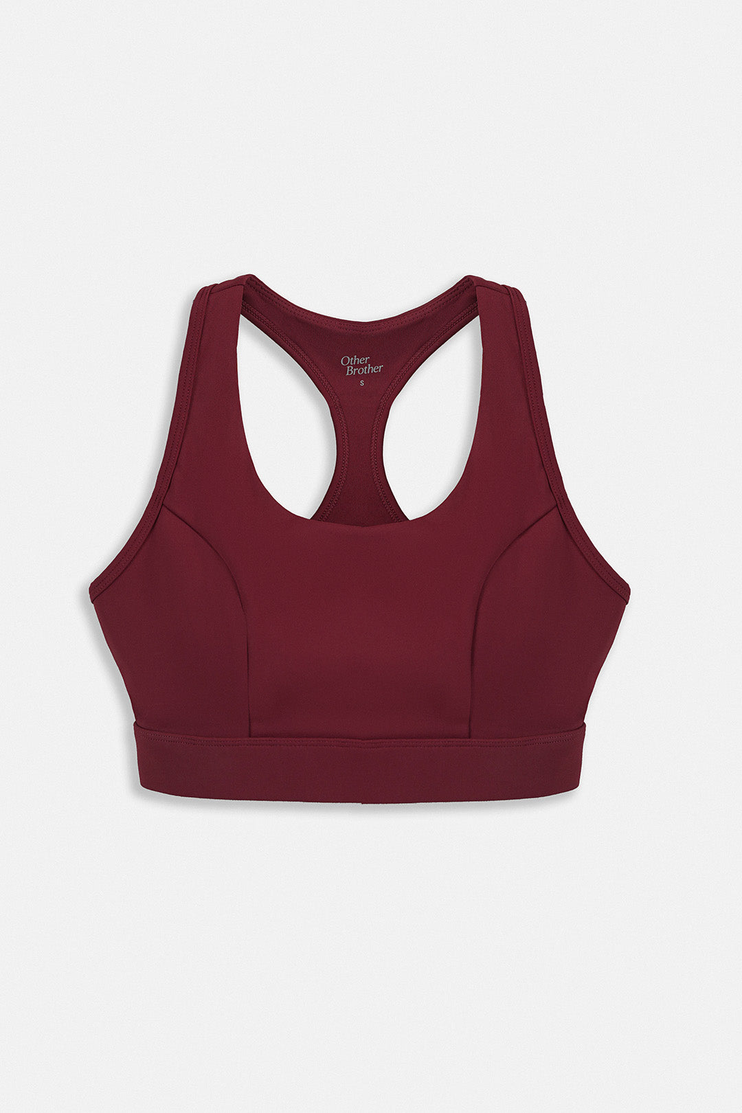 Image of A dark burgundy racerback sports bra with a wide underbust band, displayed flat against a light gray background.
