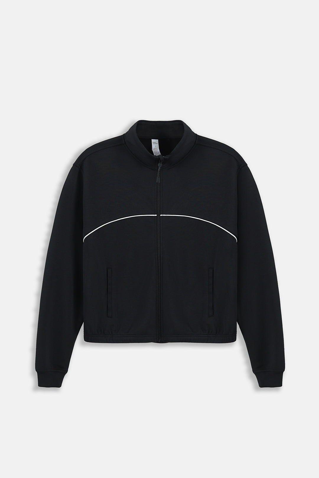 A black cropped zip-up jacket with a curved white stripe detail across the chest, displayed on a clean light gray background.