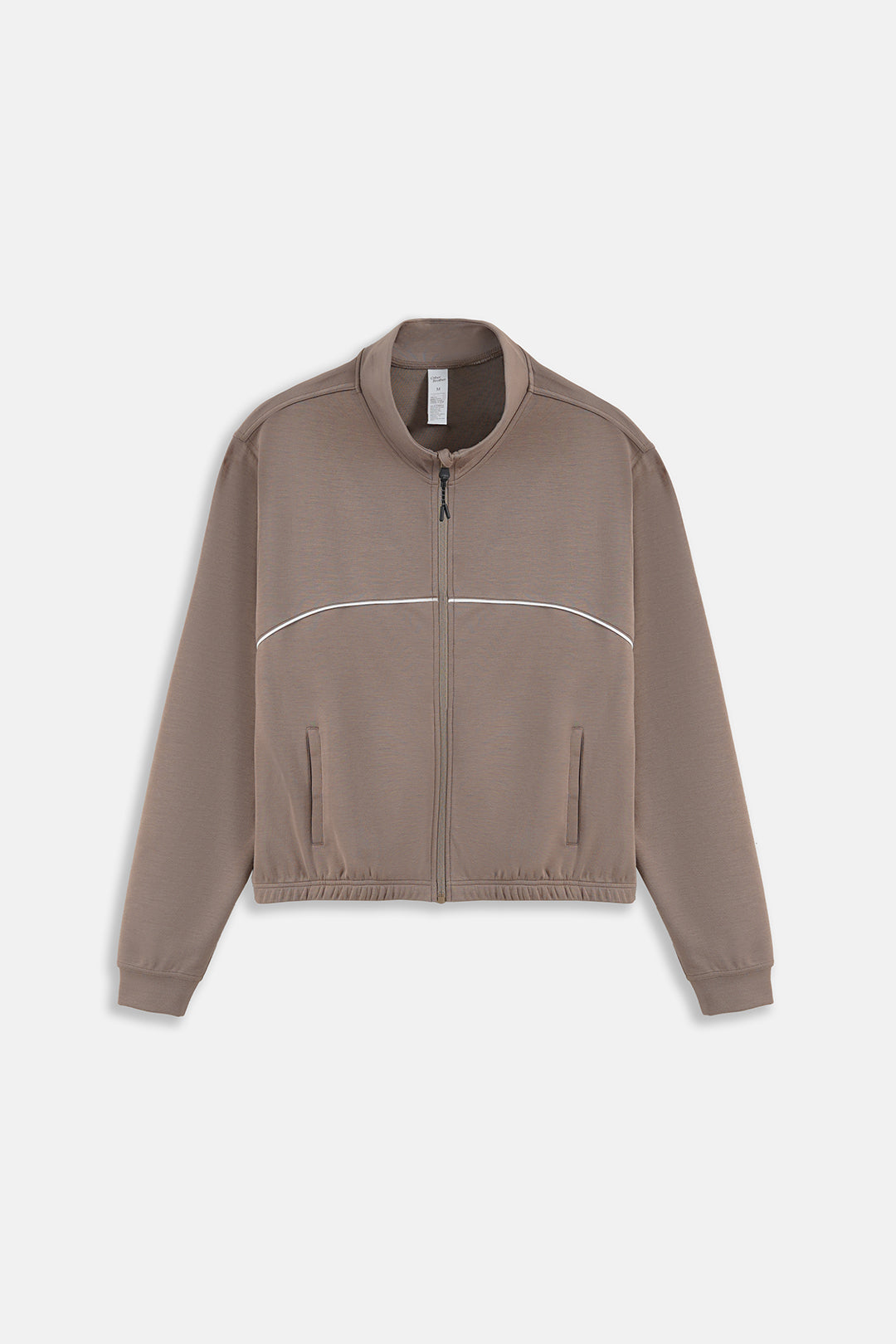 Image of A cropped zip-up jacket in a muted taupe-brown color, featuring a thin white curved stripe across the chest and zippered hand pockets, displayed on a clean light gray background.