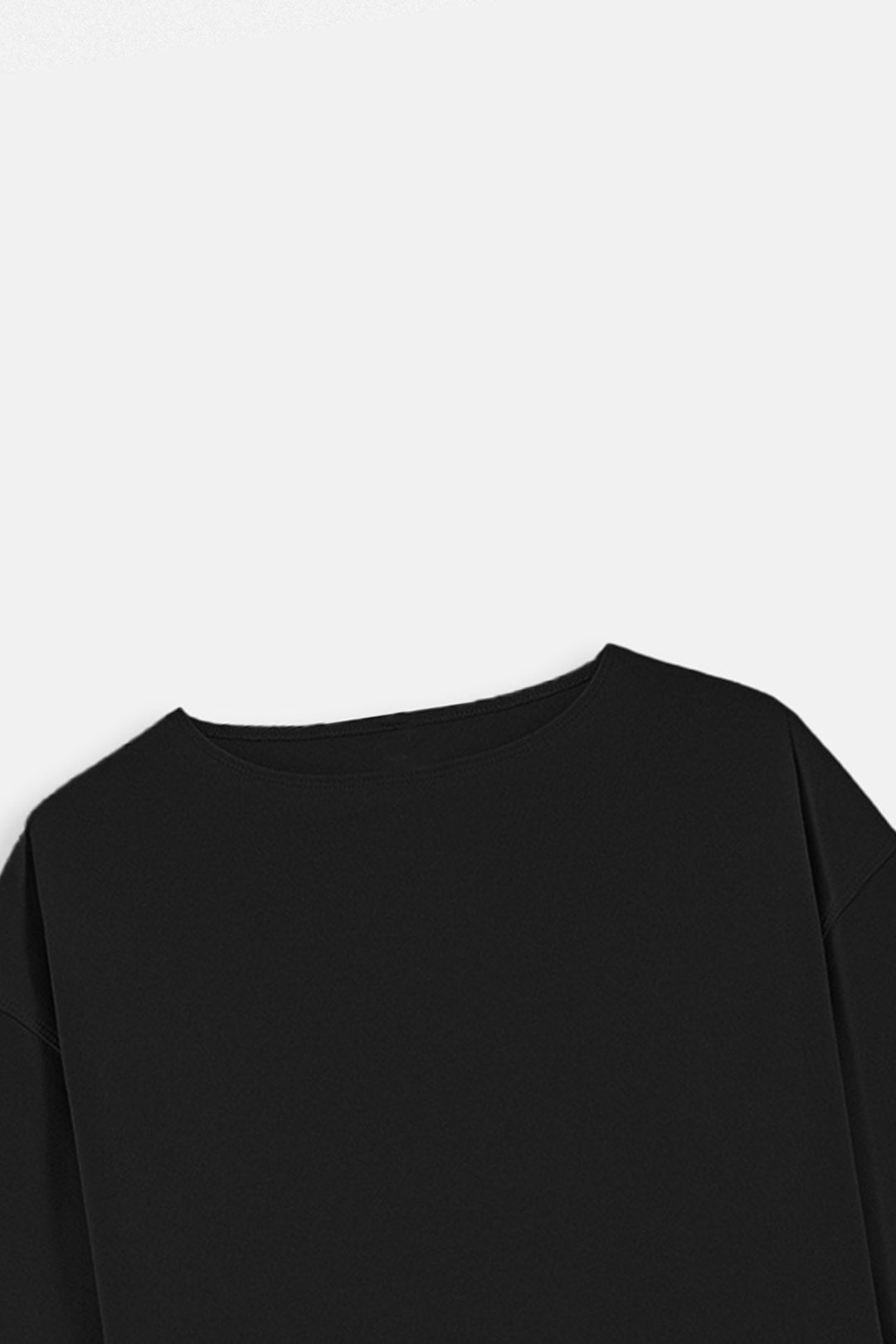 Image of Close-up of a black long-sleeve crewneck top against a plain light gray background.